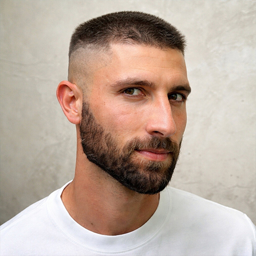 a man with a flat top fade