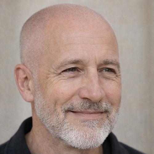 older guy with a polished buzz cut with beard
