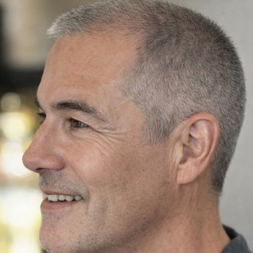 a guy with a brush cut