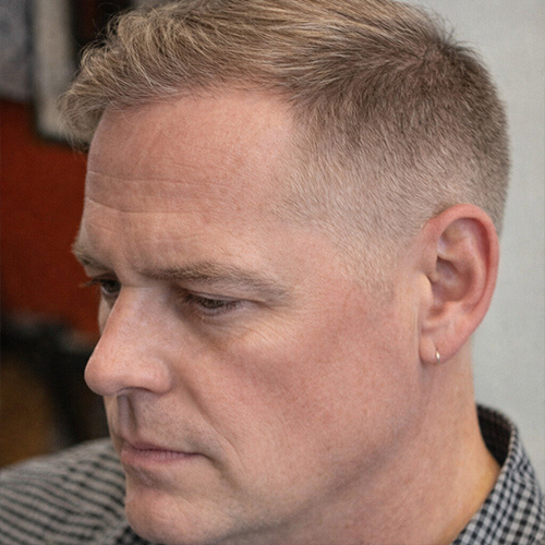 a guy with short side sweep
