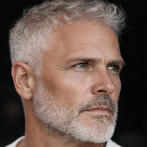 older guy with short wavy cut