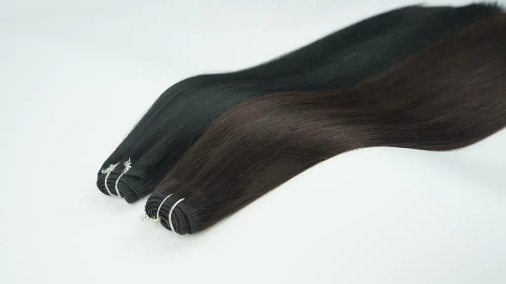 Dark brown weft hair extensions, shown as a Stage 2 profit upgrade product for salons offering fuller volume, added length, and higher-ticket transformation services.