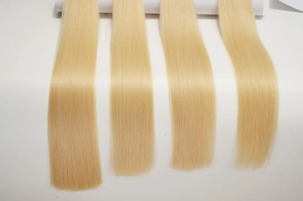 Blonde hair extension samples displayed side by side to show fullness ratio, end density, and fuller-looking results for salon quality control.