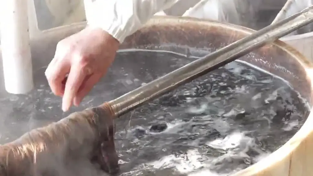 Human hair being processed in a dyeing workstation